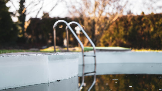 white metal bucket on water